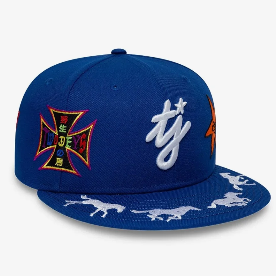 Original photo: the same embroidered blue fitted cap from a three-quarter angle