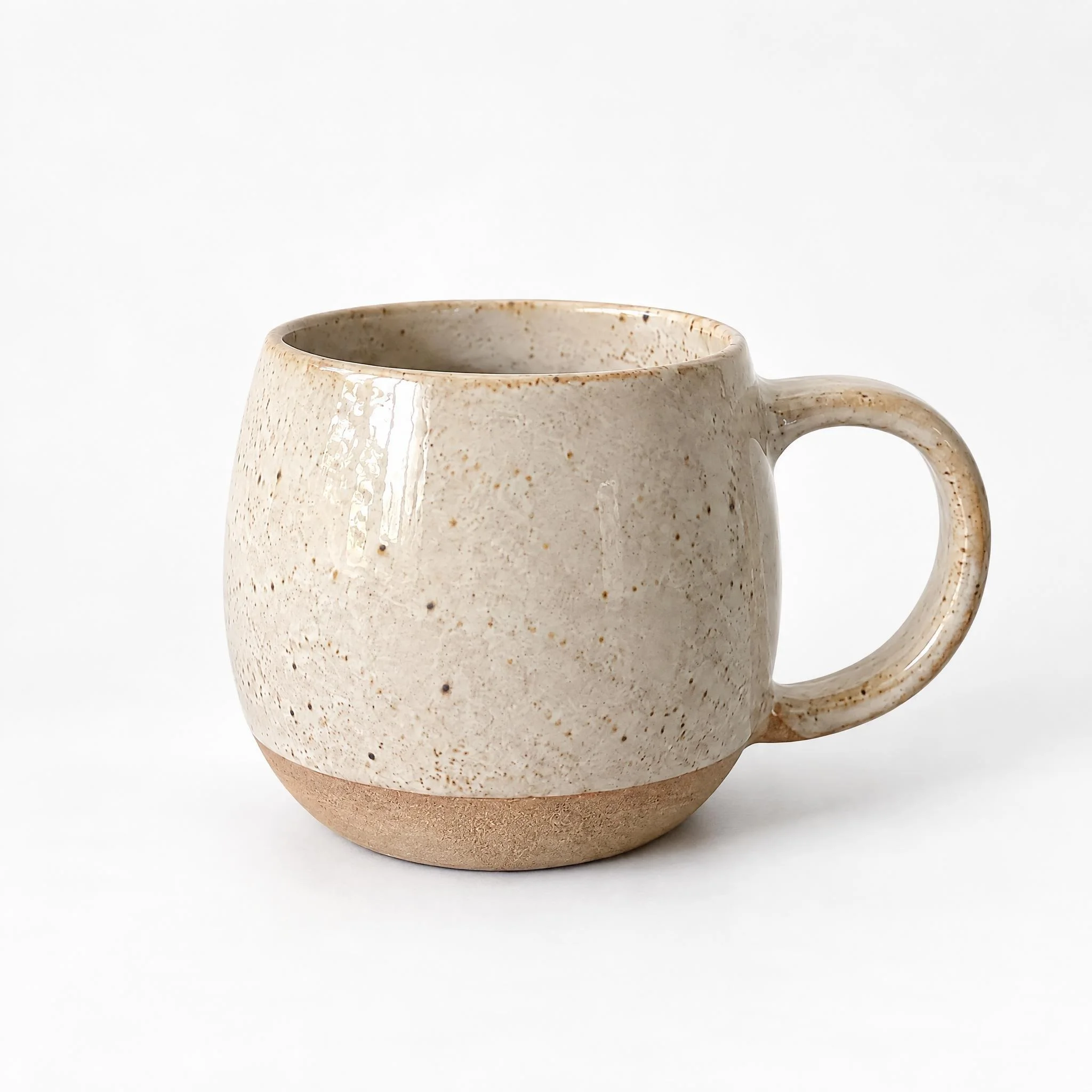 Speckled stoneware mug on a plain white background