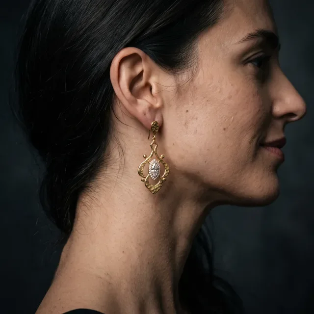Preview image of the Statement Earrings preset: A dark studio portrait with the hair pulled back, for large earrings.